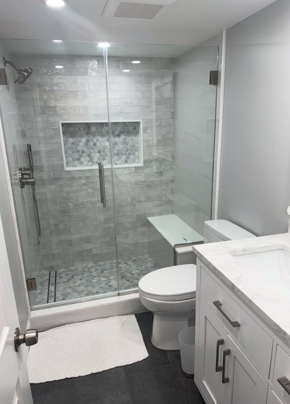 Modern bathroom remodel with glass shower enclosure in Lawton Oklahoma by VCV Services